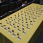 Cups for attendees charged with cognac or water awaiting the call for the toast